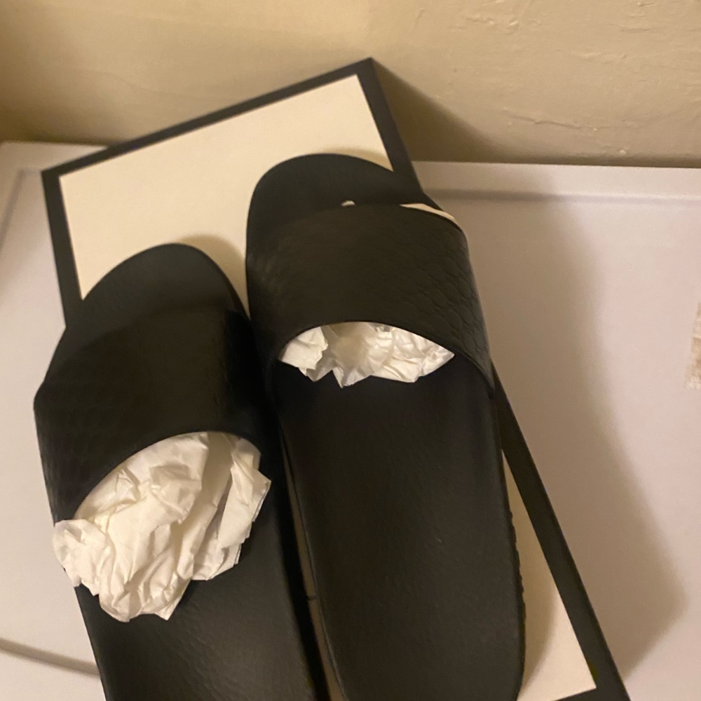 All black Gucci slides